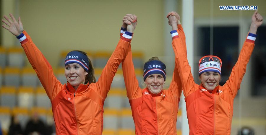 Gold Medalists team members of the Netherlands pose during the awarding ceremony of the ladies team pursuit event at ISU world single distances speed skating championships in Kolomna, Russia, on Feb. 13, 2016.