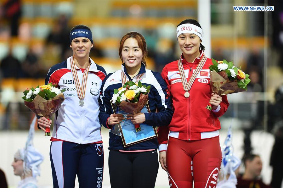 Silver medalist Brittany Bowe (L) of the United States, gold medalist Lee Sang-Hwa (C) of South Korea and bronze medalist Zhang Hong of China pose during the awarding ceremony of the ladies 500m event at ISU world single distances speed skating championships in Kolomna, Russia, on Feb. 13, 2016.