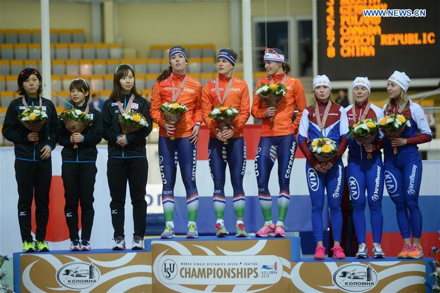 Gold Medalists team members of the Netherlands (C), silver medalists team members of Japan (L) and bronze medalists team members of Russia pose during the awarding ceremony of the ladies team pursuit event at ISU world single distances speed skating championships in Kolomna, Russia, on Feb. 13, 2016.