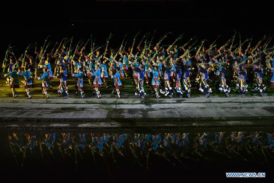 Actors perform during the opening ceremony of the Dong Culture Tourism Festival in Liping County, Qiandongnan Miao and Dong Autonomous Prefecture, southwest China's Guizhou Province, Feb. 14, 2016.