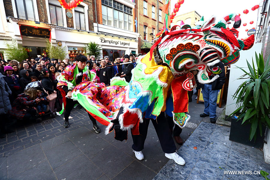Chinese dragon dancers take part in a parade to celebrate Chinese Lunar New Year in central London, Britain, on Feb. 14, 2016