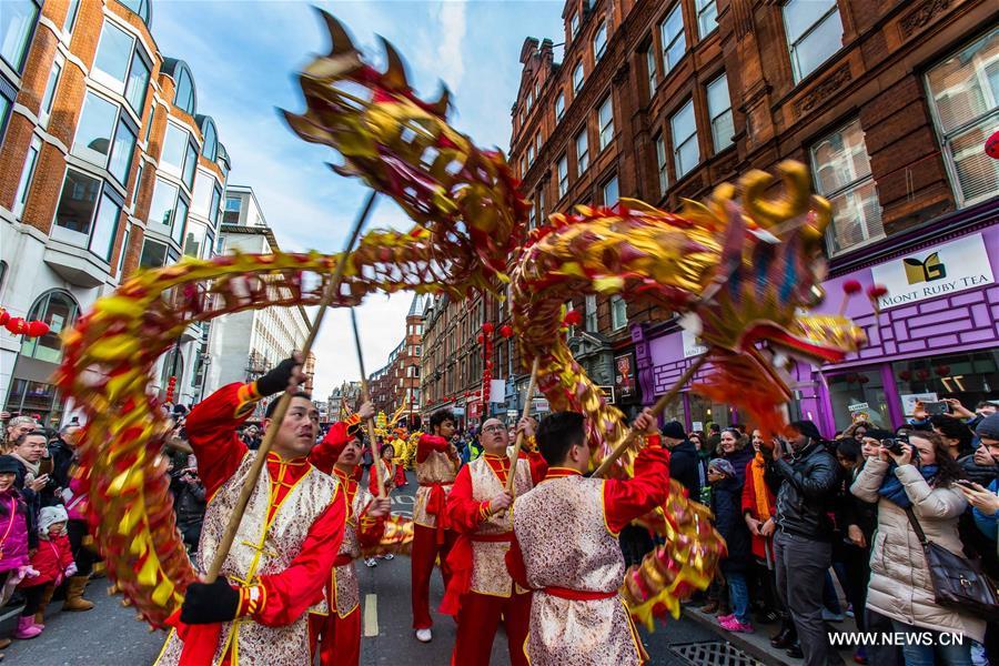 Chinese dragon dancers take part in a parade to celebrate Chinese Lunar New Year in central London, Britain, on Feb. 14, 2016