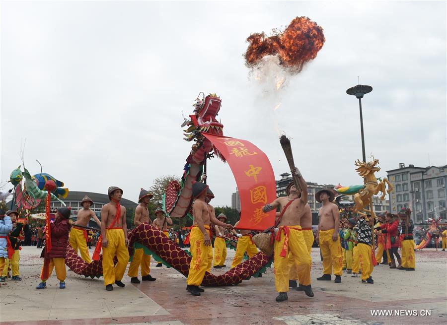 The Binyang-style dance is a derivative of traditional dragon dance in which performers hold dragon on poles and walk through floods of firecrackers.