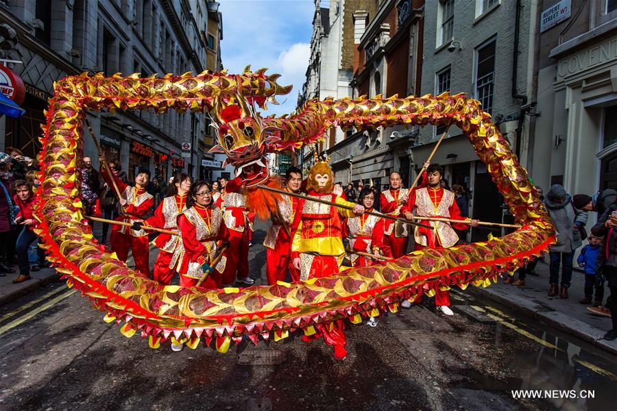 Chinese dragon dancers take part in a parade to celebrate Chinese Lunar New Year in central London, Britain, on Feb. 14, 2016