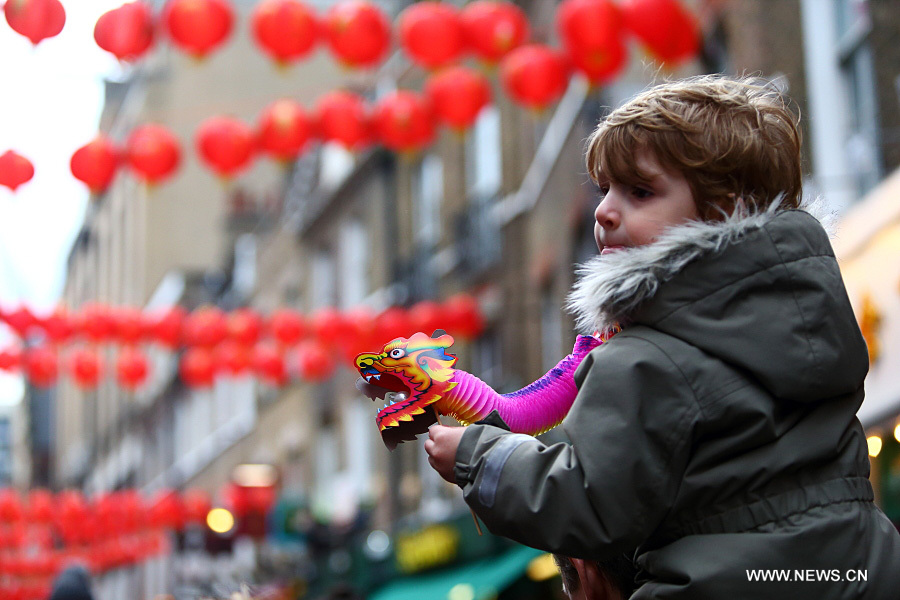 Chinese dragon dancers take part in a parade to celebrate Chinese Lunar New Year in central London, Britain, on Feb. 14, 2016