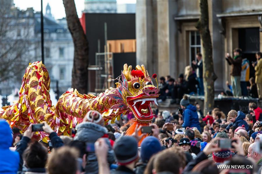 Chinese dragon dancers take part in a parade to celebrate Chinese Lunar New Year in central London, Britain, on Feb. 14, 2016