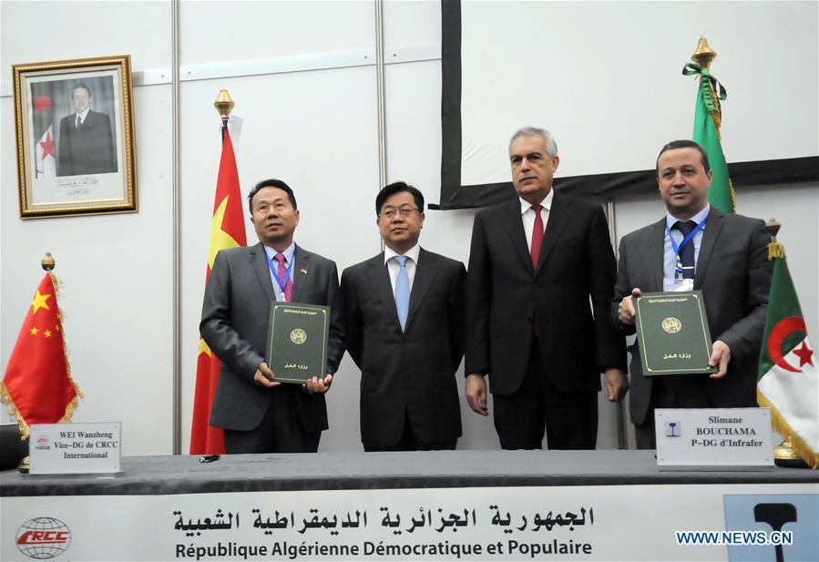 Wei Wanzheng, vice-general manager of China Railway Construction Corporation (CRCC) International, Yang Guangyu, Chinese ambassador to Algeria, Boujemaa Talai, transport minister of Algeria, and Slimane Bouchama, CEO of the National Company of Railway Construction of Algeria(Infrafer) pose for a photo during the signing ceremony in Algiers, Algeria, Feb. 15, 2016. 