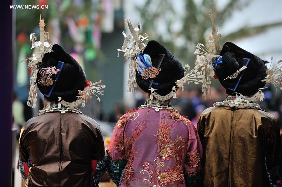 Women of Miao ethnic group attend a festival gathering to sing Miao songs at Ma'an Village of Congjiang County, Qiandongnan Miao and Dong Autonomous Prefecture, southwest China's Guizhou Province, Feb. 13, 2016.