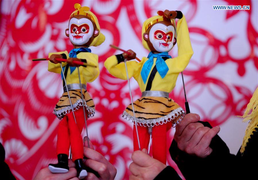 An exhibitor displays Liaoxi puppets during an intangible cultural heritage show at Liaoning Grand Theater in Shenyang, northeast China's Liaoning Province, Feb. 18, 2016. 