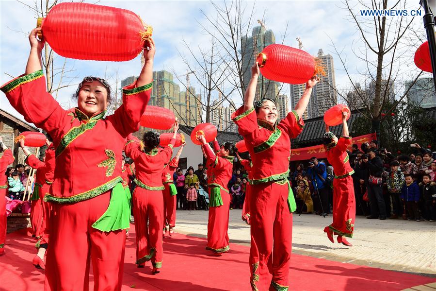 People dance in Hefei, capital of east China's Anhui Province, Feb. 18, 2016. 