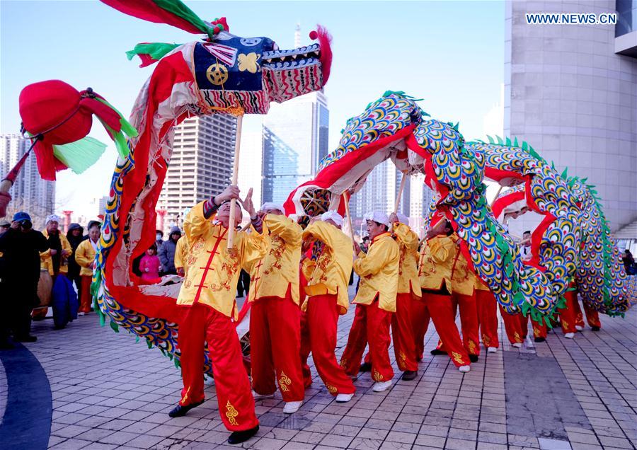 Folk actors perform dragon dance during an intangible cultural heritage show at Liaoning Grand Theater in Shenyang, northeast China's Liaoning Province, Feb. 18, 2016.