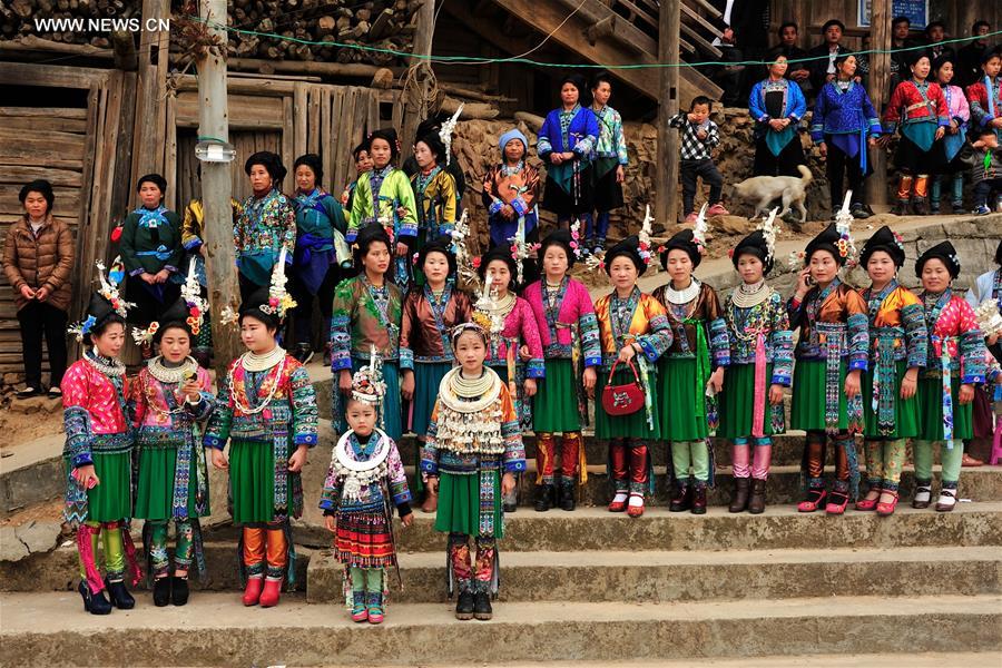 Women of Miao ethnic group attend a festival gathering to sing Miao songs at Ma'an Village of Congjiang County, Qiandongnan Miao and Dong Autonomous Prefecture, southwest China's Guizhou Province, Feb. 13, 2016.