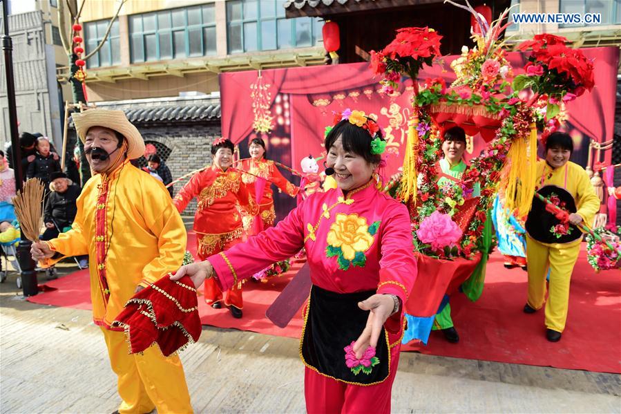 People perform Boat Dance, a form of rural folk dance, in Hefei, capital of east China's Anhui Province, Feb. 18, 2016. 