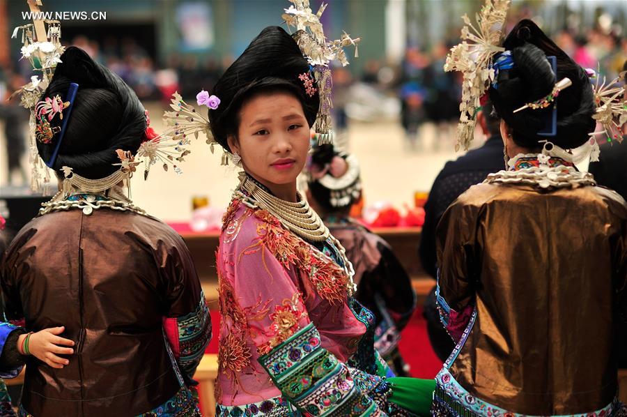 Women of Miao ethnic group attend a festival gathering to sing Miao songs at Ma'an Village of Congjiang County, Qiandongnan Miao and Dong Autonomous Prefecture, southwest China's Guizhou Province, Feb. 13, 2016. 