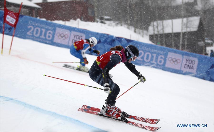 Riikka Honkanen (R) of Finland and Lucia Rispler of Germany compete during the Parallel Mixed Team Event of Alpine Skiing at Lillehammer 2016 Winter Youth Olympic Games in Lillehammer, Norway on Feb. 20, 2016. 