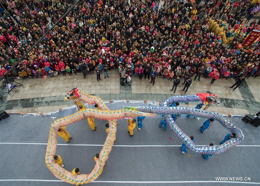 Dragon dance teams perform to celebrate the traditional Lantern Festival in Luxian County, southwest China's Sichuan Province, Feb. 22, 2016. N)