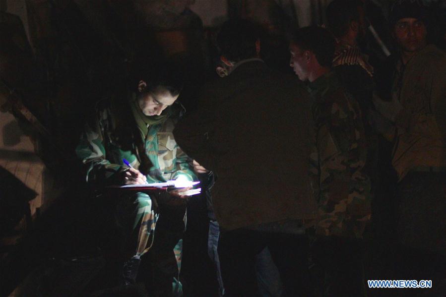 Syrians gather at the site of a series of attacks in the district of Sayyidah Zaynab, south of Damascus, Syria, Feb. 21, 2016. 