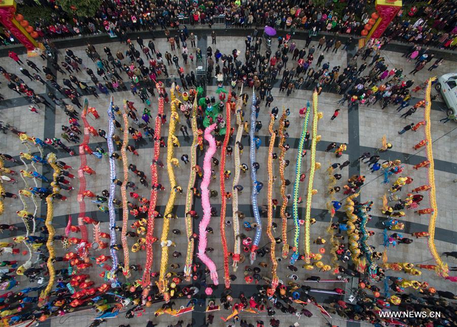 Dragon dance teams perform to celebrate the traditional Lantern Festival in Luxian County, southwest China's Sichuan Province, Feb. 22, 2016. 