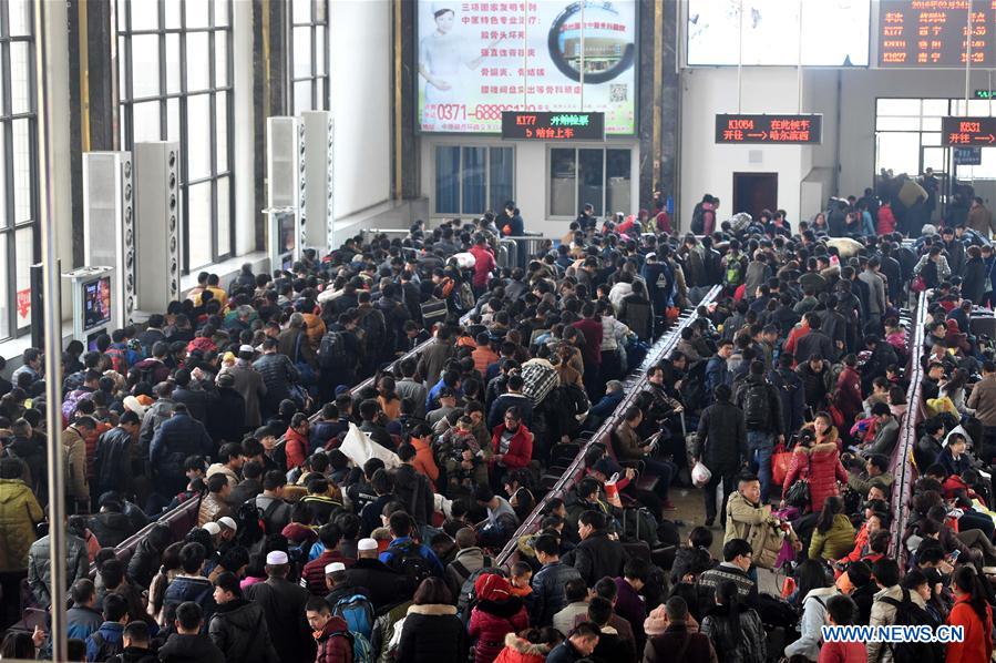 Passengers gather in the waiting room of the railway station of Zhengzhou, capital of central China's Henan Province, Feb. 24, 2016.