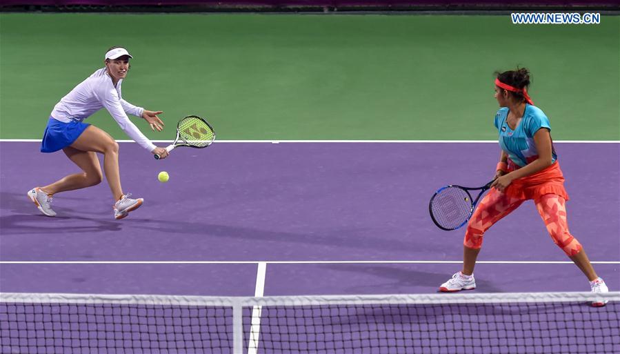 Martina Hingis (L) of Switzerland and Sania Mirza of India compete during their women's doubles second round match against Zheng Saisai and Xu Yifan of China at the WTA Qatar Open 2016 in Doha, Qatar, Feb. 23, 2016. 