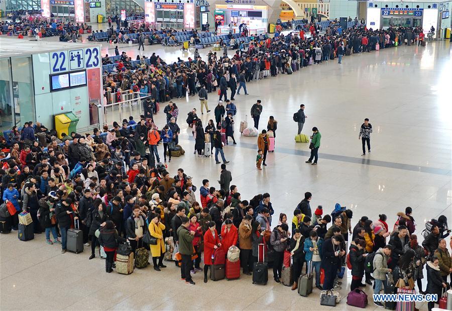 Passengers queue in the railway station of Shijiazhuang, capital of north China's Hebei Province, Feb. 24, 2016.