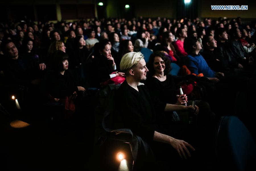 Guests watch a movie during the opening ceremony of the 1st Berlin Chinese Film Festival at the Kino Babylon in Berlin, Germany, on Feb. 24, 2016. 