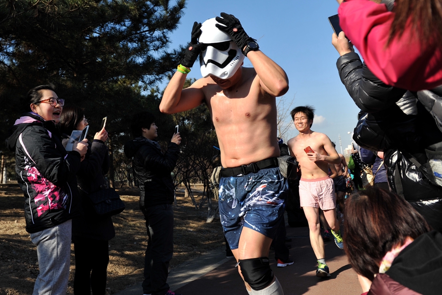 Runners at Beijing's 'naked run' race