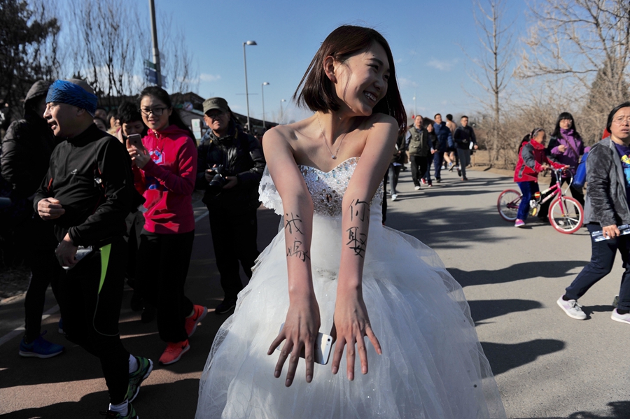 Runners at Beijing's 'naked run' race