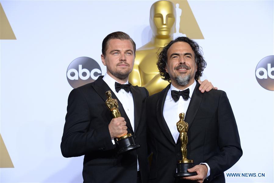 Leonardo DiCaprio (L) and director Alejandro G. Inarritu of 'The Revenant' pose after winning the best actor and best director respectively during the 88th Academy Awards in Los Angeles, the United States, on Feb. 28, 2016.