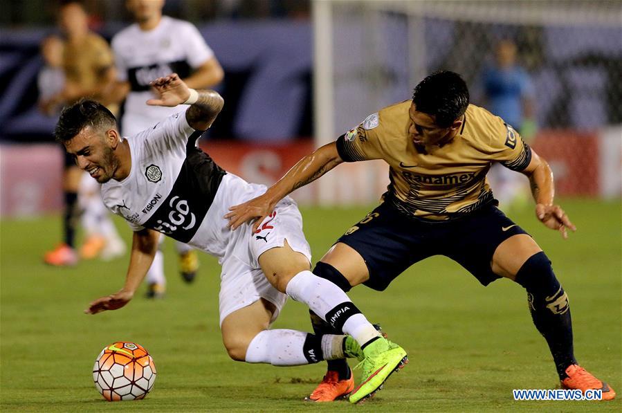 Image taken for Club Universidad Nacional A.C. (PUMAS) shows Olimpia's Ariel Nunez (L) of Paraguay vying for the ball with UNAM's Pumas Marcelo Alatorre of Mexico during the match of Group 7 of Copa Libertadores, at Manuel Ferreira Stadium in Asuncion, capital of Paraguay, on March 1, 2016. 