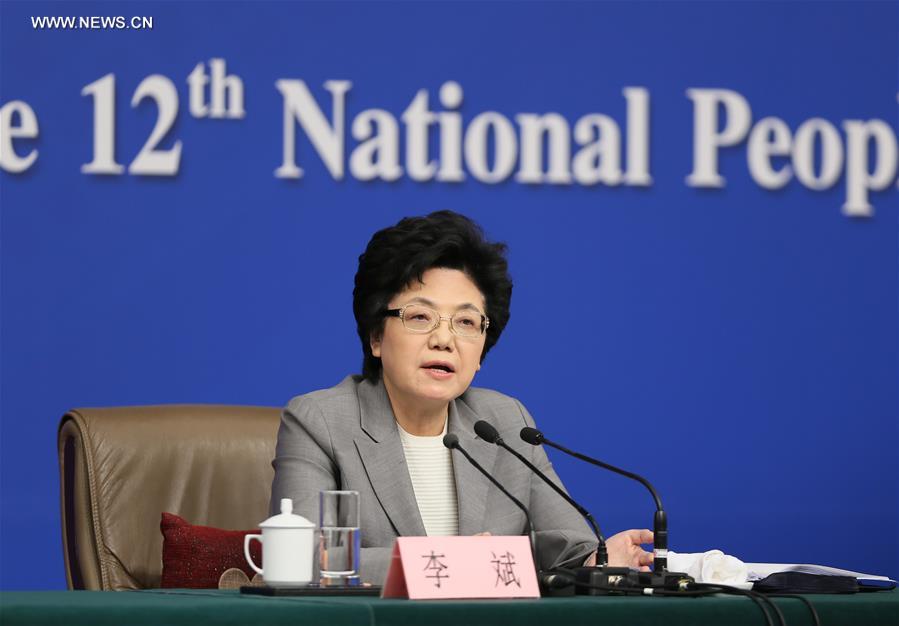 Li Bin, minister in charge of the National Health and Family Planning Commission, gives a press conference on China's two-child policy on the sidelines of the fourth session of China's 12th National People's Congress in Beijing, capital of China, March 8, 2016.