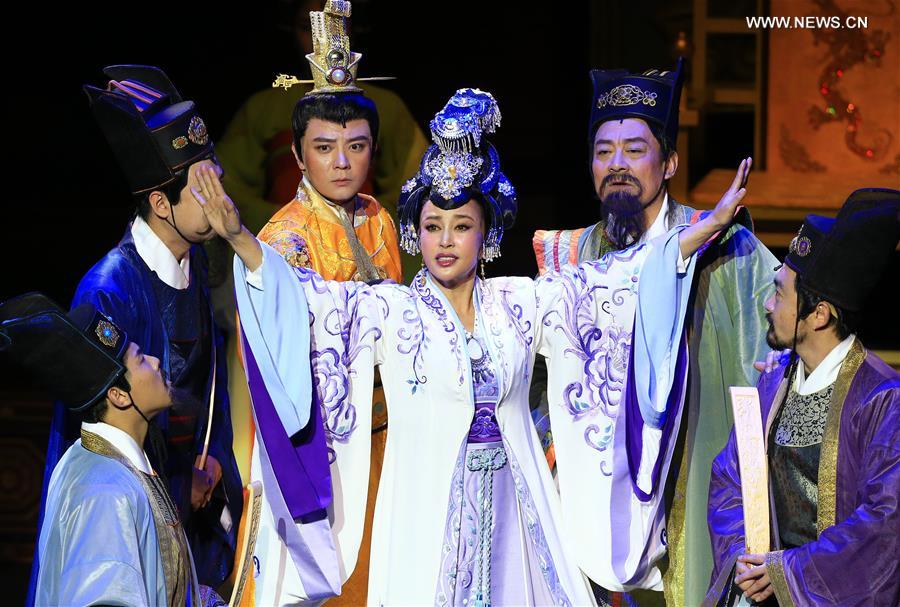 Actress Liu Xiaoqing (C) performs in the large-scale legendary play 'Empress Wu Zetian' at Metro Toronto Convention Centre's John Bassett Theatre in Toronto, Canada, March 11, 2016.