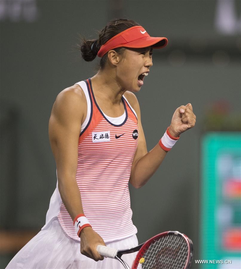 Zhang Shuai of China celebrates during the women's singles 3rd round match against Victoria Azarenka of Belarus at the BNP Paribas Open in Indian Wells, California, the United States on March 14, 2016