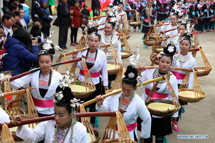  People of Dong ethnic group sing local songs to celebrate a festival blessing for good fortune in Long'e Town of Qiandongnan Miao and Dong Autonomous Prefecture, southwest China's Guizhou Province, March 16, 2016. 