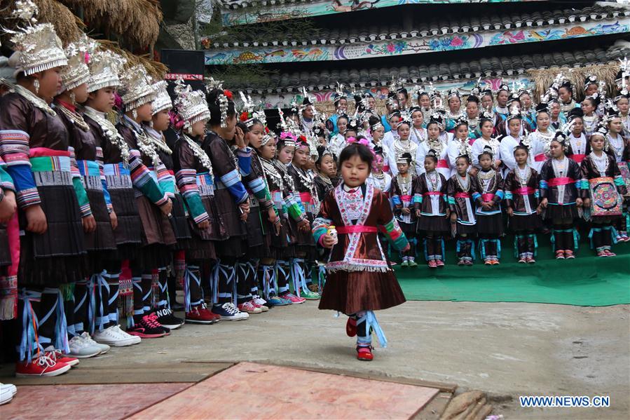  People of Dong ethnic group sing local songs to celebrate a festival blessing for good fortune in Long'e Town of Qiandongnan Miao and Dong Autonomous Prefecture, southwest China's Guizhou Province, March 16, 2016. 
