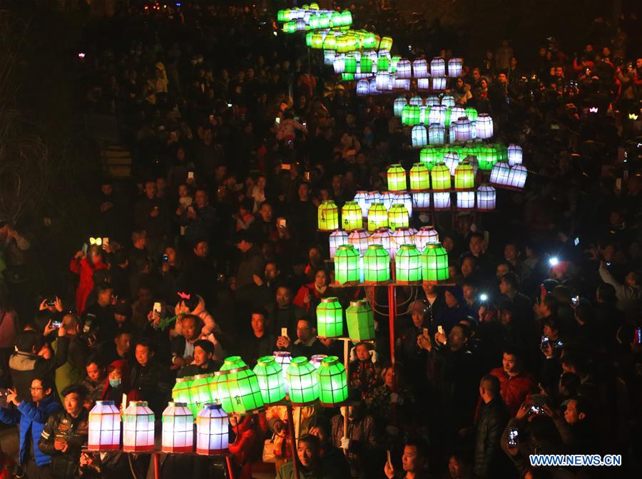People perform dragon dance during Huodeng Festival in Jiepai Town, Hengyang County of central China's Hunan Province, March 15, 2016.