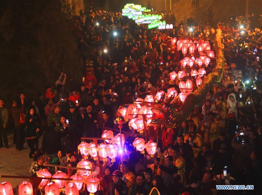 People perform dragon dance during Huodeng Festival in Jiepai Town, Hengyang County of central China's Hunan Province, March 15, 2016.