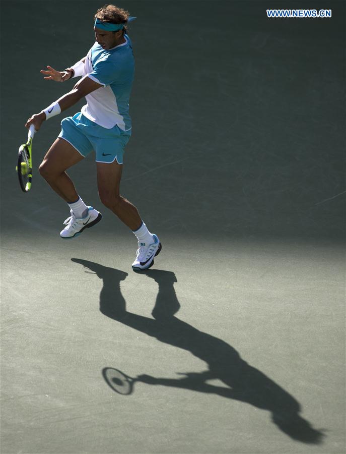 Nadal of Spain returns a shot during his third round men's singles against Fernando Verdasco of Spain at the BNP Paribas Open in Indian Wells, the United States, on March 15, 2016. 