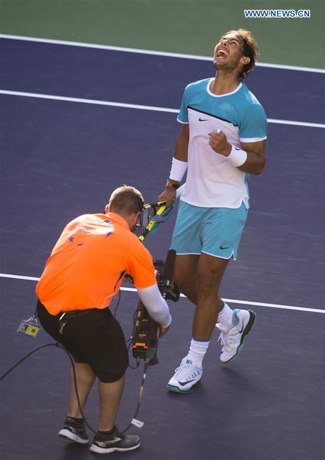 Rafael Nadal (R) of Spain celebrates after his third round men's singles against Fernando Verdasco of Spain at the BNP Paribas Open in Indian Wells, the United States, on March 15, 2016. 