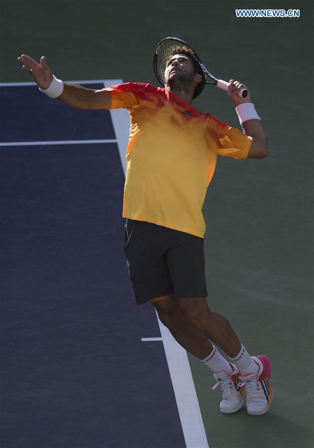 Fernando Verdasco of Spain serves during his third round men's singles against Rafael Nadal of Spain at the BNP Paribas Open in Indian Wells, the United States, on March 15, 2016. 