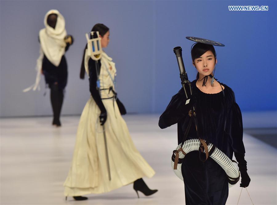Models present creations at a special show for creative women's fashion in Beijing, capital of China, March 15, 2016. 