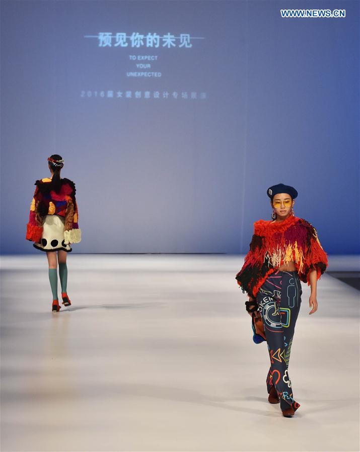 Models present creations at a special show for creative women's fashion in Beijing, capital of China, March 15, 2016.