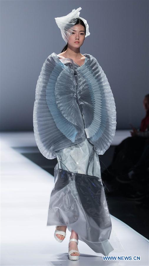 A model presents a creation designed by graduates of Beijing Institute of Fashion Technology during a fashion week of the institute in Beijing, capital of China, March 15, 2016. 