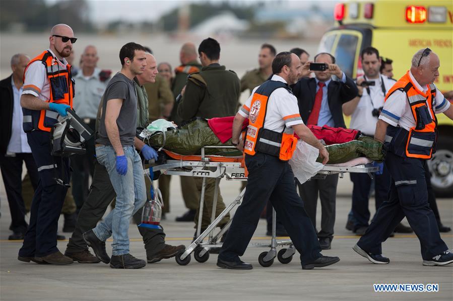 Emergency personnel transfer injured Israeli in the Istanbul suicide bomb attack upon their arrival at the Ben Gurion airport near Tel Aviv, Israel, March 20, 2016.