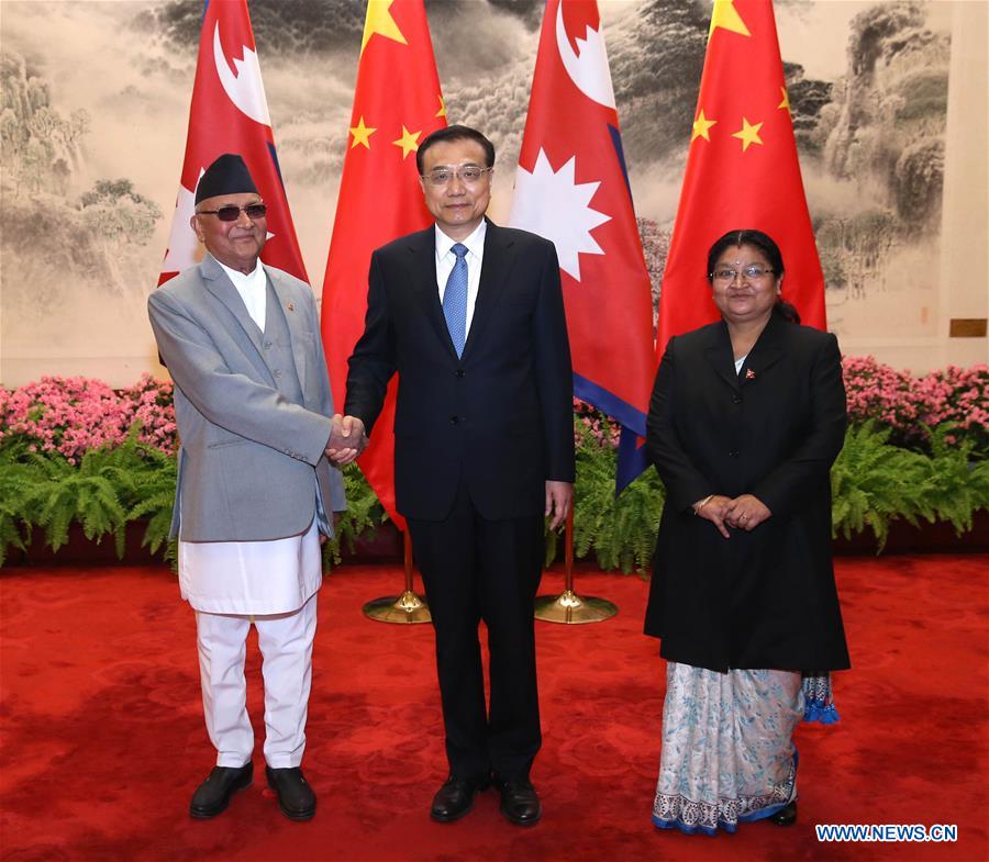  Chinese Premier Li Keqiang (C) meets with Nepalese Prime Minister K. P. Oli (L) in Beijing, capital of China, March 21, 2016. 