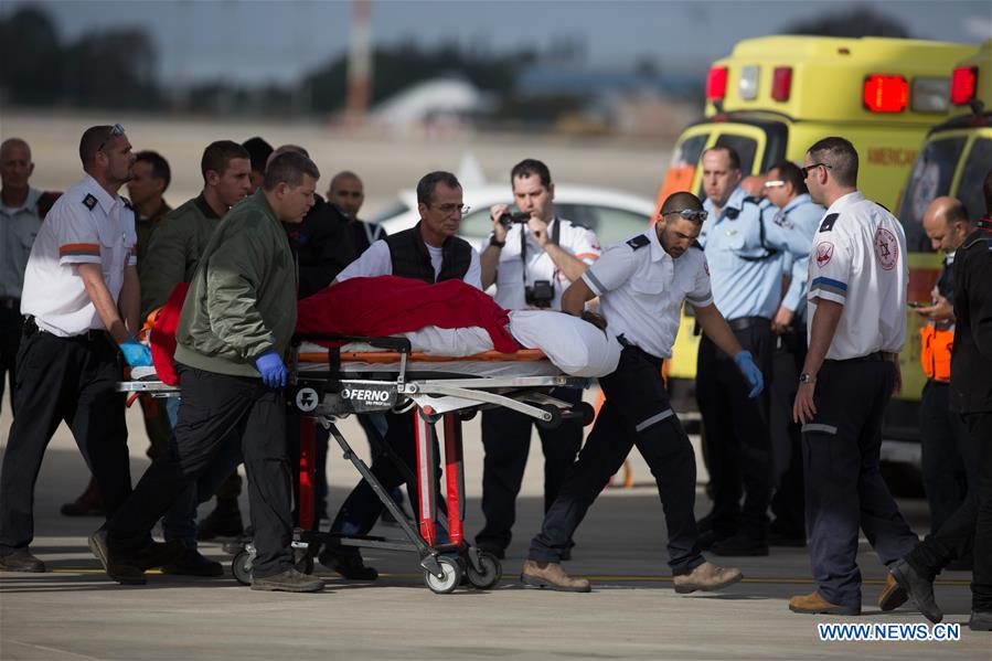 Emergency personnel transfer injured Israeli in the Istanbul suicide bomb attack upon their arrival at the Ben Gurion airport near Tel Aviv, Israel, March 20, 2016.