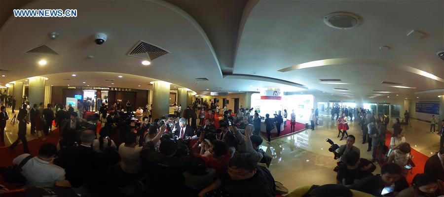 Panoramic photo shows guests taking interview from journalists in the annual Boao Forum for Asia (BFA) in Boao, south China's Hainan Province, March 22, 2016. 