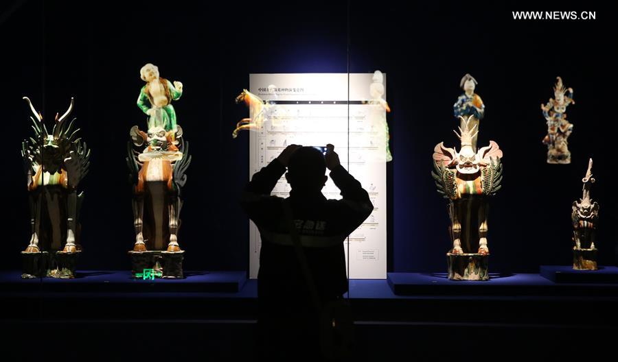 Tri-colored glazed pottery works are seen displayed at an exhibition in Shaanxi History Museum in Xi'an, capital of northwest China's Shaanxi Province, March 23, 2016. 