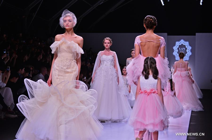A model presents a creation by designer Lan Yu during the Shanghai Fashion Week in Shanghai, east China, April 8, 2016. The Fashion Week kicked off here Friday.