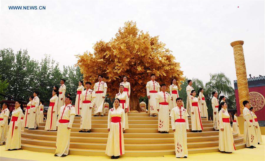 Actors perform during an ancestor worship grand ceremony in honor of Huangdi, the Yellow Emperor, held at mausoleums in Xinzheng, central China's Henan Province, Huangdi's birth place, on April 9, 2016, the third day of the third month on the Chinese lunar calendar, which is considered the birthday of Huangdi. 